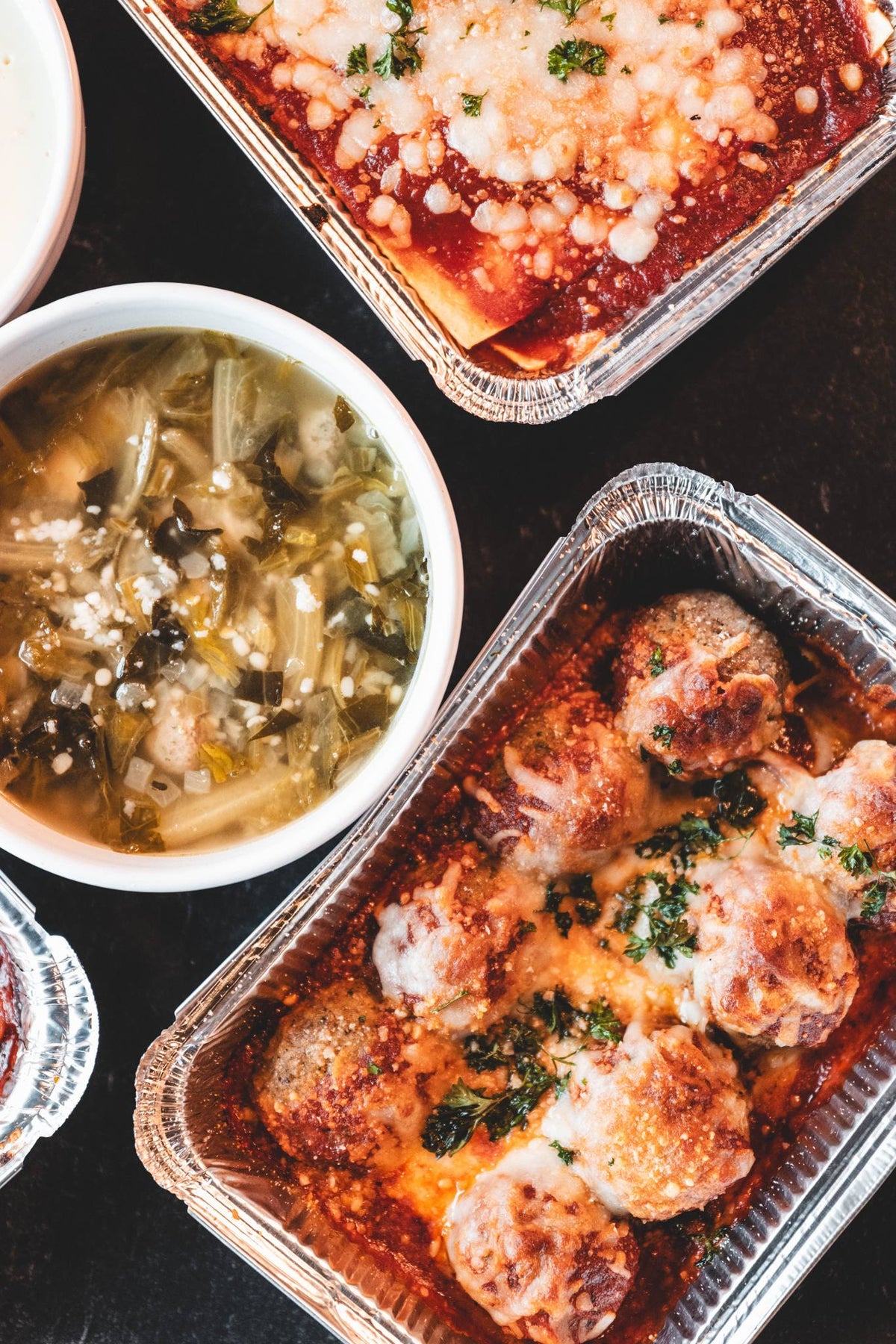 Antone's Kitchen Baked Meatball Parmesan tray with melted mozzarella, overhead