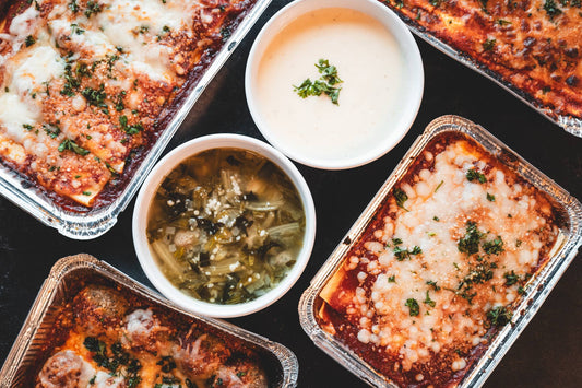 Antone's Kitchen lasagna trays with Alfredo sauce and Italian Wedding Soup, overhead