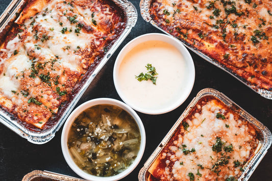 Antone's Kitchen lasagna trays with Alfredo sauce and Italian Wedding Soup, overhead